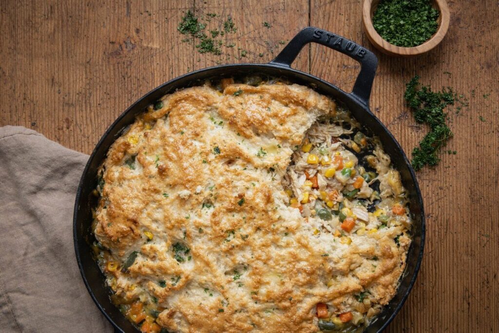 Easy chicken pot pie with Bisquick biscuit topping, golden and bubbling from the oven, ready in 50 minutes