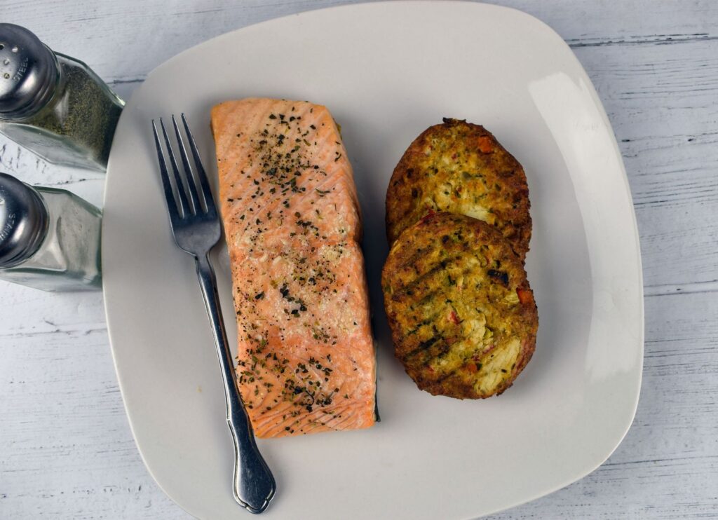 Baked red salmon recipe — plated salmon cakes made from canned red salmon on white plate