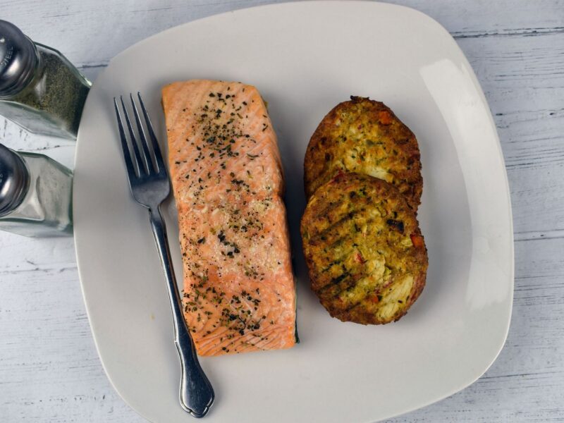Baked red salmon recipe — plated salmon cakes made from canned red salmon on white plate