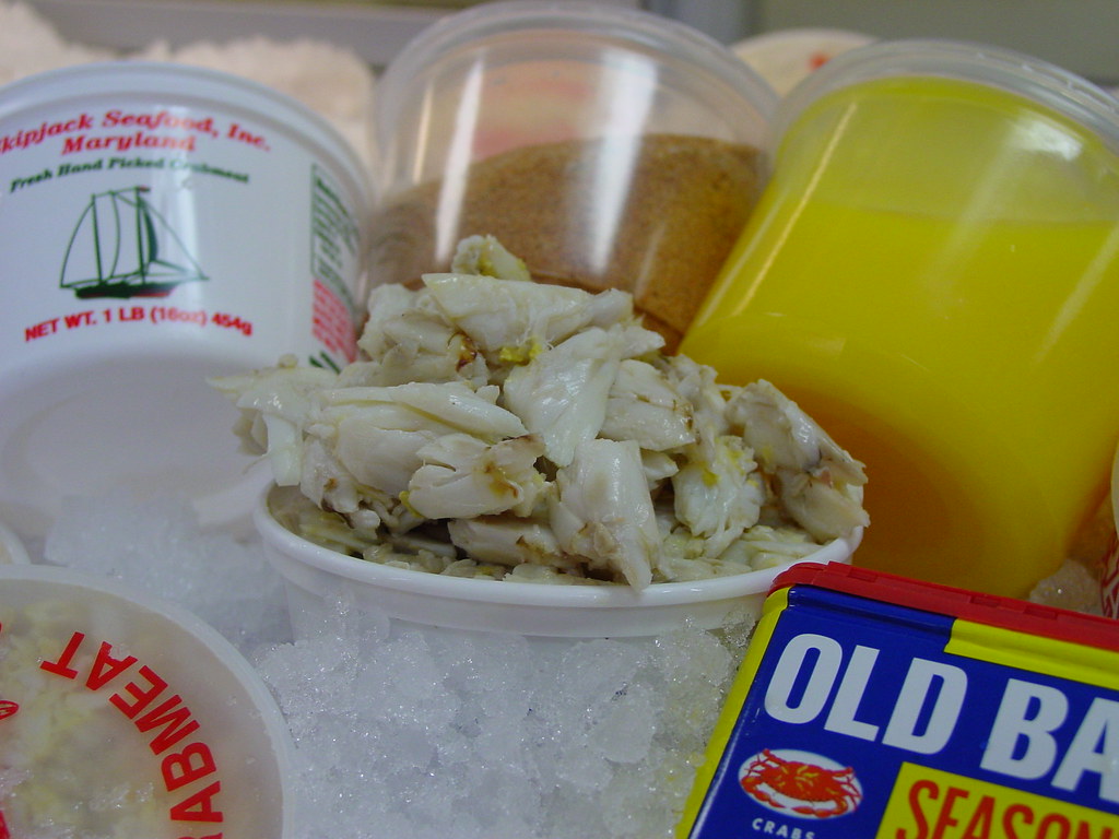 Container of fresh picked lump crab meat on ice at a Maryland seafood shop